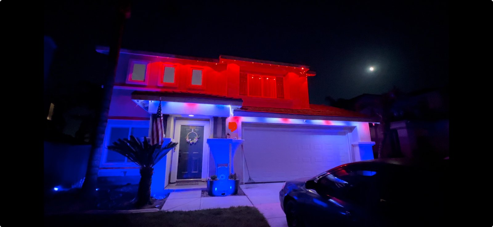 First floor uses Outdoor LED Strip, second floor uses Permanent Outdoor Lights. Lower level walls lit with Flood Lights.